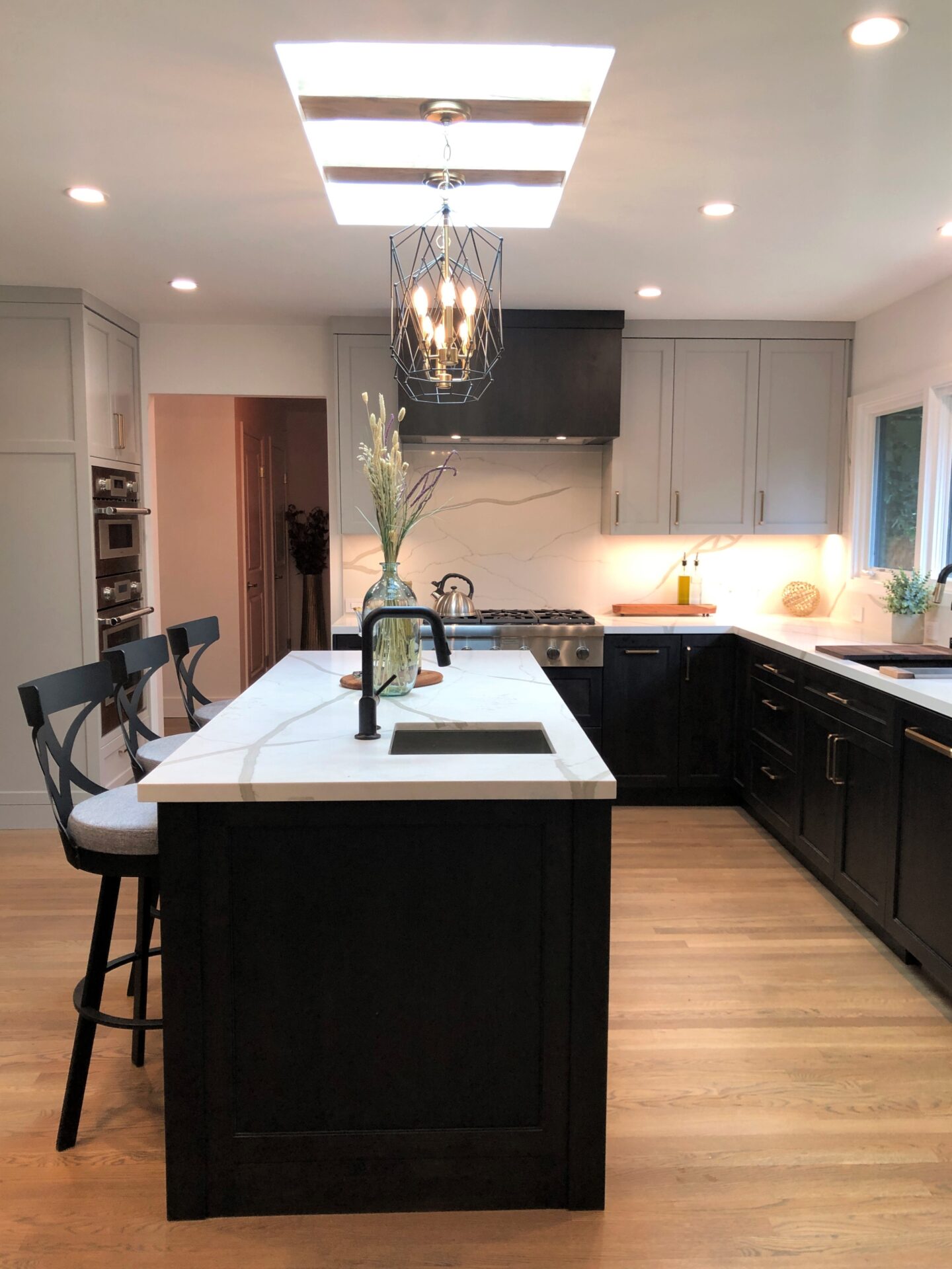 An Island of a Kitchen With a Sink