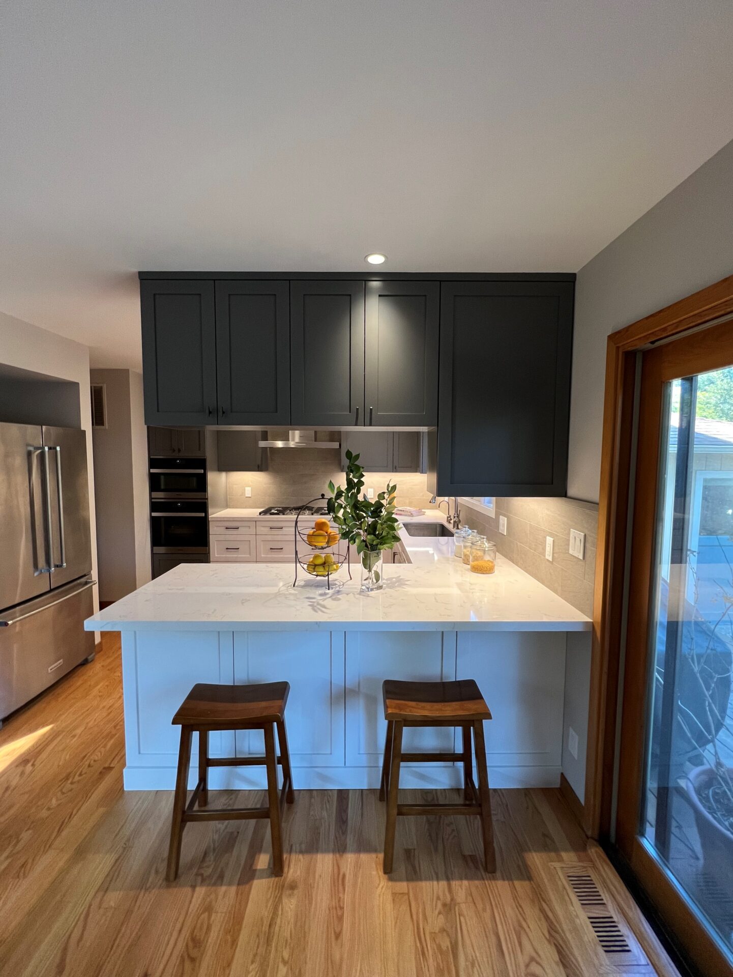 A U Shaped Kitchen Cabinet With Black Cupboards