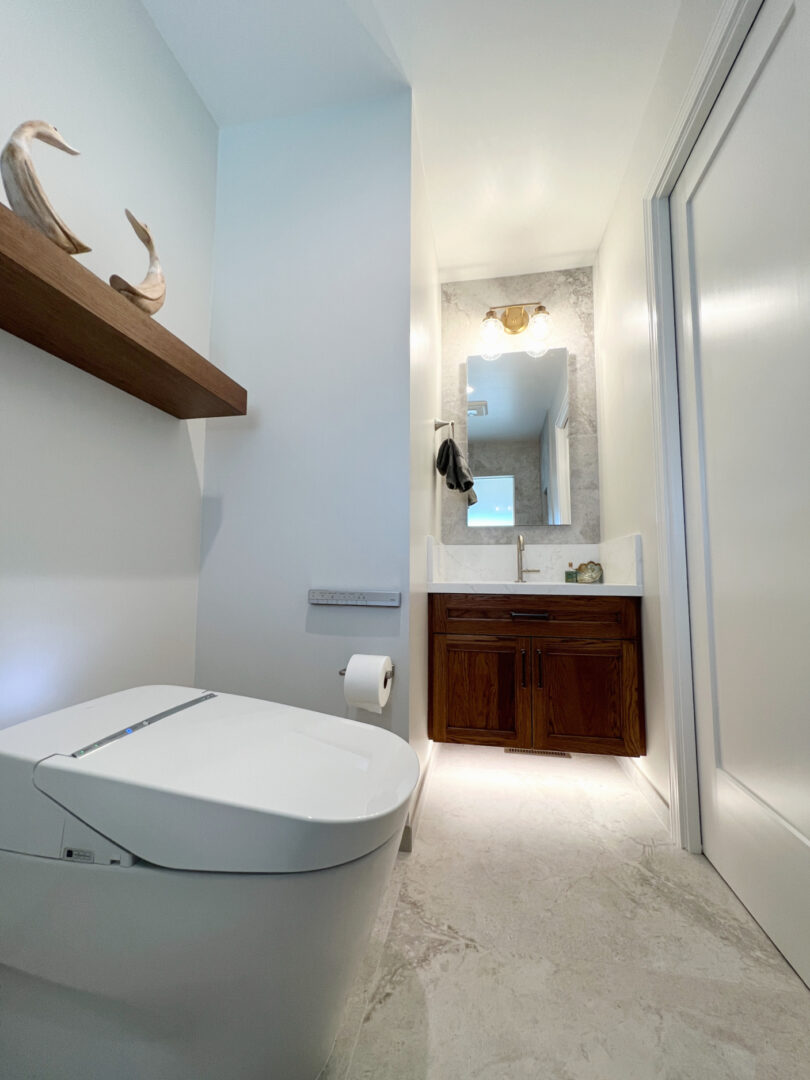 A White Color Fittings With a Wooden Sink Space