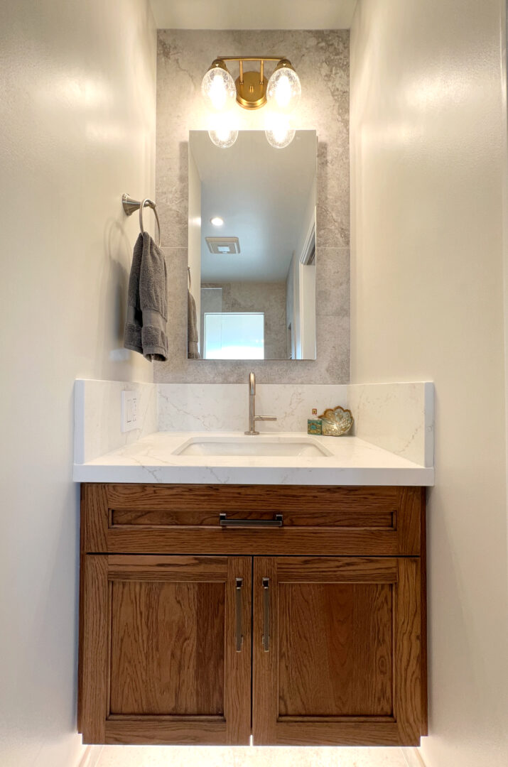 A Wooden Cabinets With a White Color Sink