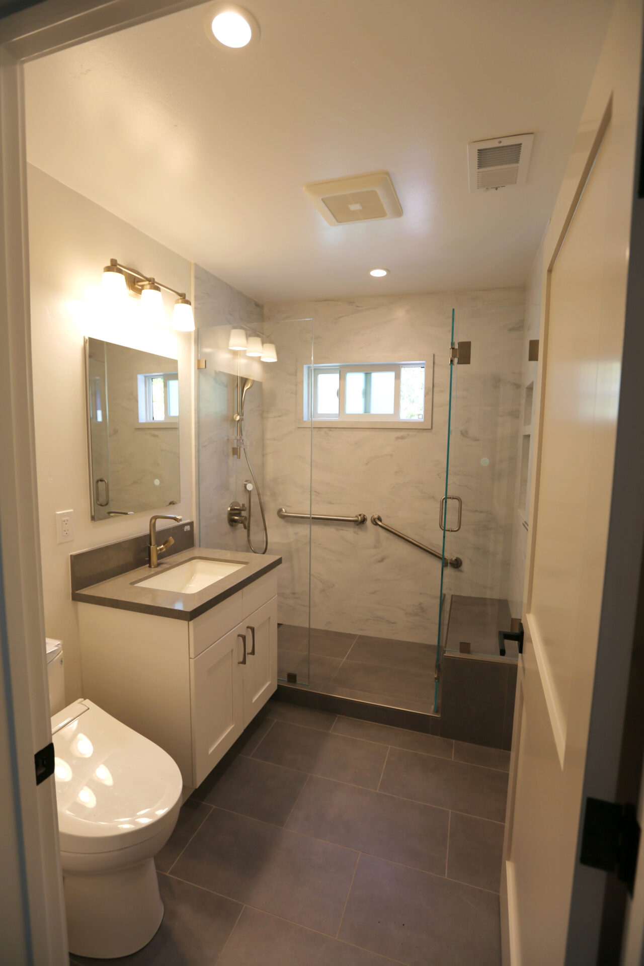 A Bathroom With a Clear Glass Shower Cabinet